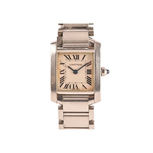 A Cartier Tank ladies stainless steel quartz wristwatch, reference 2384, the white dial with black Roman numerals, signed Cartier, with jewelled crown, the case back signed and numbered 837935UF, 20mm case.