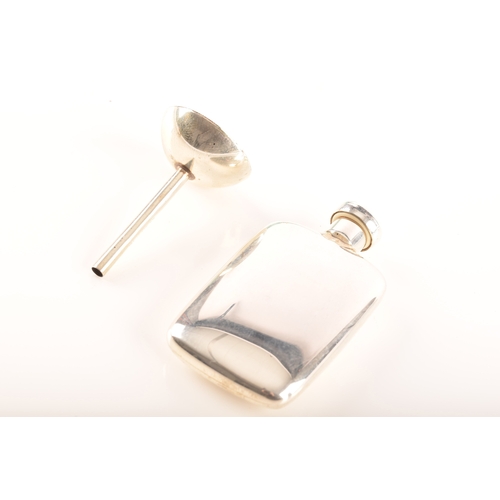 99 - Tiffany & Co. A silver perfume bottle and funnel, together with a Tiffany & Co silver multi ... 