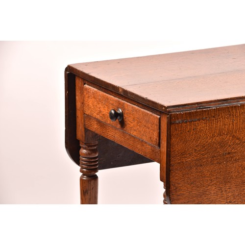 377 - An 18th century oak drop flap Pembroke table, with a pair of folding flaps, end drawer and supported... 