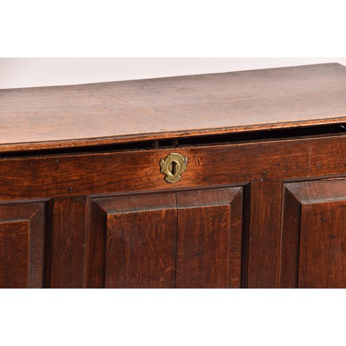 378 - An 18th century oak coffer, with hinged folding lid, triple panelled front over two short drawers, 1... 