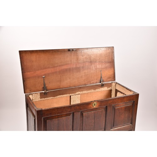 378 - An 18th century oak coffer, with hinged folding lid, triple panelled front over two short drawers, 1... 