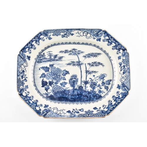 306 - A 19th century Chinese blue and white porcelain meat platter, decorated with a landscape scene of ba... 