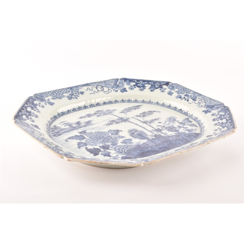 306 - A 19th century Chinese blue and white porcelain meat platter, decorated with a landscape scene of ba... 