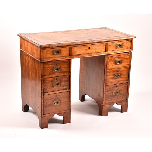 372 - A Victorian mahogany campaign pedestal desk, of small proportions, the gilt tooled leather top, over... 