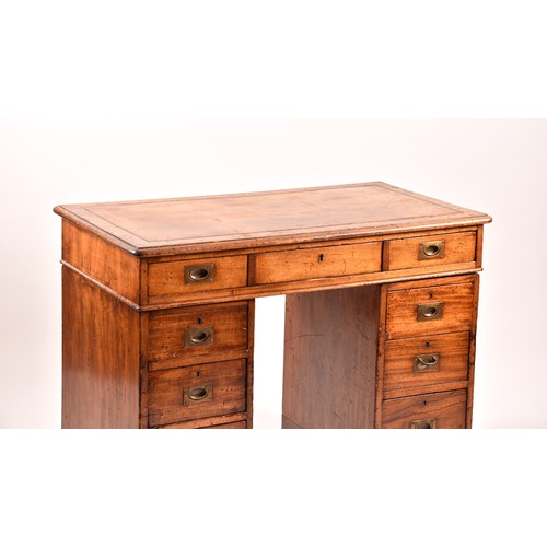 372 - A Victorian mahogany campaign pedestal desk, of small proportions, the gilt tooled leather top, over... 