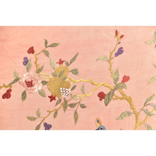 297 - A large Chinese silk work picture, decorated with a central scene of an Asiatic pheasant stood on a ... 