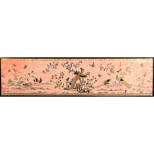 297 - A large Chinese silk work picture, decorated with a central scene of an Asiatic pheasant stood on a ... 