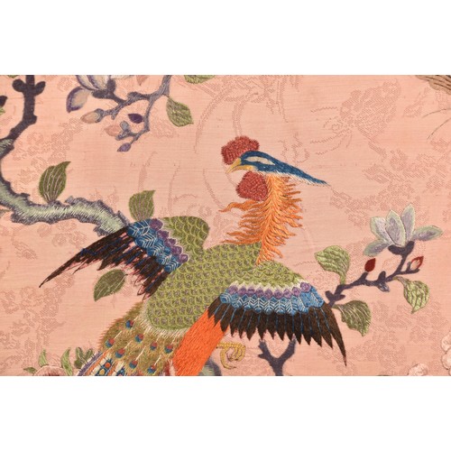 297 - A large Chinese silk work picture, decorated with a central scene of an Asiatic pheasant stood on a ... 