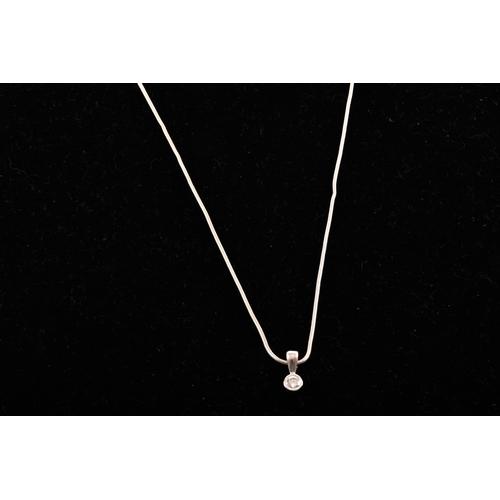 24 - An 18ct white gold diamond necklace, the pendant set with a round brilliant cut diamond with an appr... 