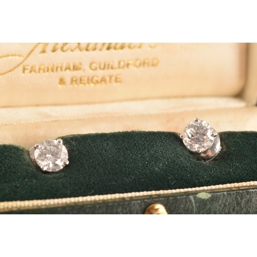 5 - A pair of 18ct white gold round brilliant cut diamond earrings, total approximate diamond weight of ... 