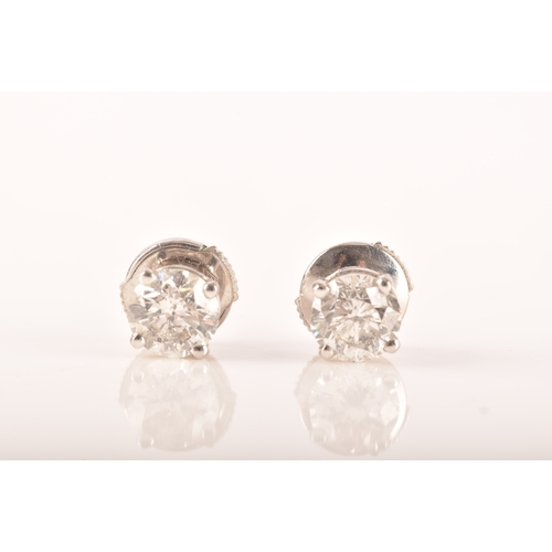 5 - A pair of 18ct white gold round brilliant cut diamond earrings, total approximate diamond weight of ... 