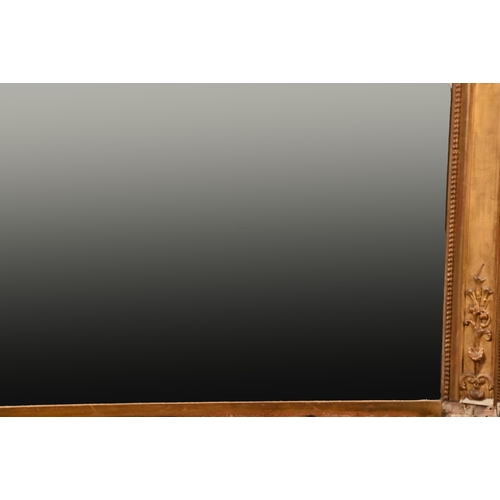 379 - A very large 19th century French gilt wall mirror, mounted with a central coat of arms, scrolling su... 