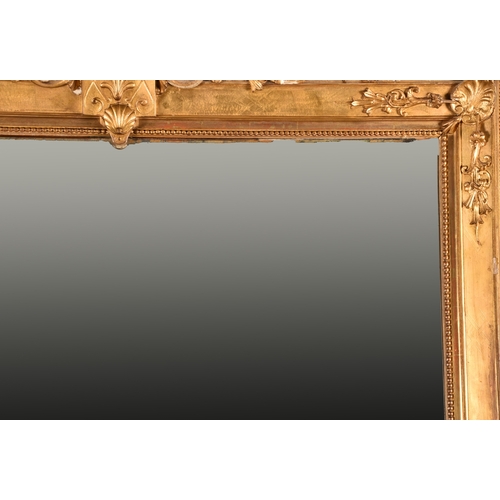 379 - A very large 19th century French gilt wall mirror, mounted with a central coat of arms, scrolling su... 