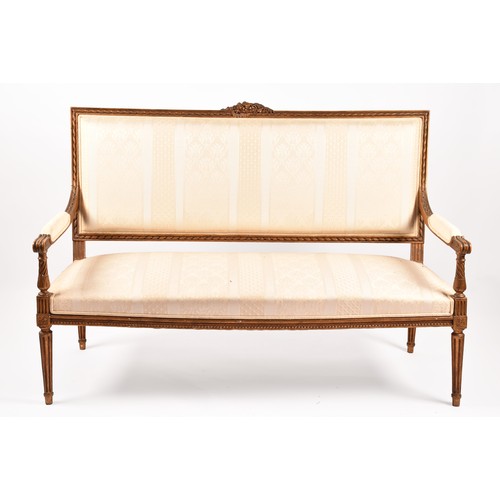 380 - A French 19th century Louis XVI style giltwood salon suite, comprising a settee, a pair of armchairs... 