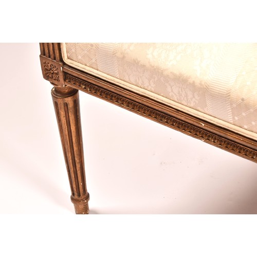 380 - A French 19th century Louis XVI style giltwood salon suite, comprising a settee, a pair of armchairs... 