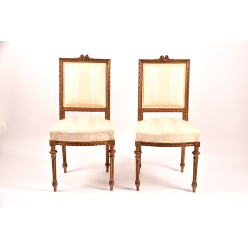 380 - A French 19th century Louis XVI style giltwood salon suite, comprising a settee, a pair of armchairs... 