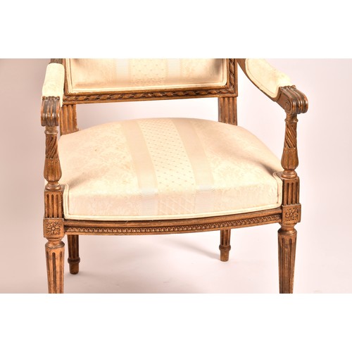 380 - A French 19th century Louis XVI style giltwood salon suite, comprising a settee, a pair of armchairs... 