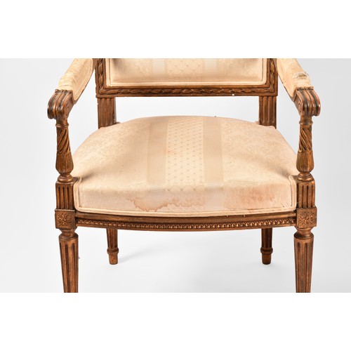 380 - A French 19th century Louis XVI style giltwood salon suite, comprising a settee, a pair of armchairs... 