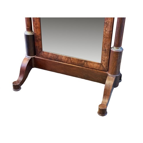 381 - A large French Empire cheval mirror, with flame mahogany frame, supported on tapering columns with o... 