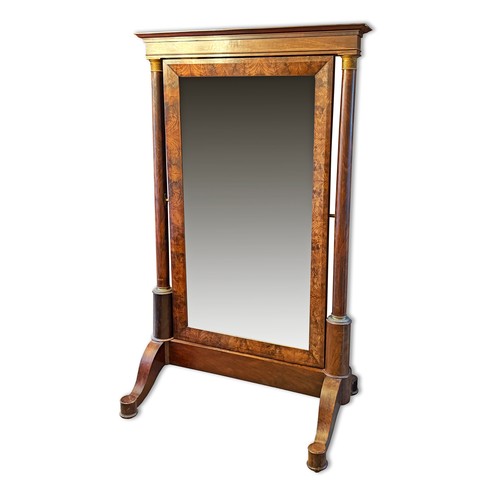 381 - A large French Empire cheval mirror, with flame mahogany frame, supported on tapering columns with o... 