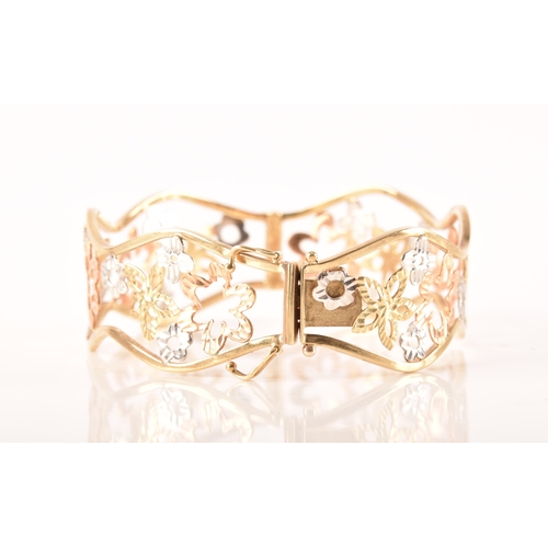 23 - A 9ct white, rose and gold openwork floral bracelet, 6cm, 11 grams, in presentation box.