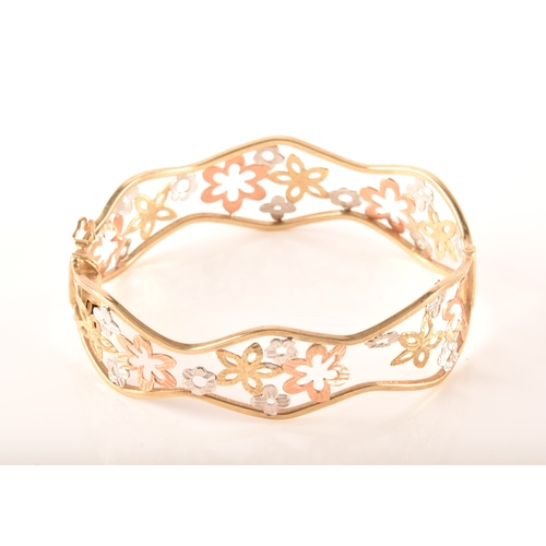 23 - A 9ct white, rose and gold openwork floral bracelet, 6cm, 11 grams, in presentation box.