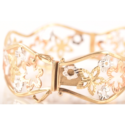 23 - A 9ct white, rose and gold openwork floral bracelet, 6cm, 11 grams, in presentation box.