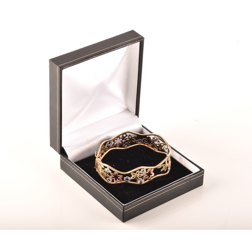 23 - A 9ct white, rose and gold openwork floral bracelet, 6cm, 11 grams, in presentation box.