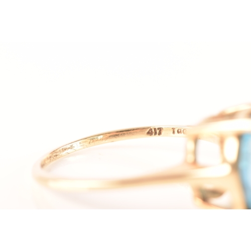 94 - A 10ct yellow gold topaz ring, set with a round blue topaz with an approximate weight of 7.30 carats... 