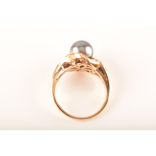 30 - An 18ct pearl and diamond cocktail ring, set to centre with a pearl, surrounded by ten brilliant cut... 