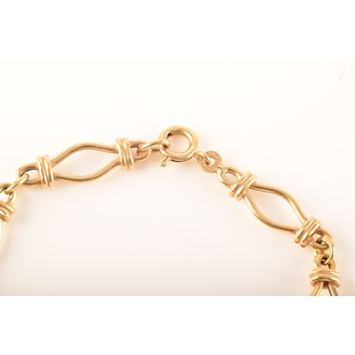 25 - An 18ct yellow gold fancy link bracelet, 19cm long.