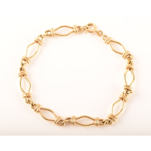 25 - An 18ct yellow gold fancy link bracelet, 19cm long.