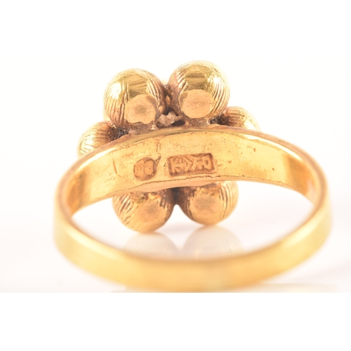 19 - A Chinese yellow metal ring, with a ten-ball pyramid design, size K, Chinese hallmarks to interior o... 