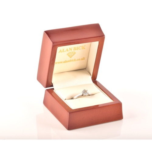 7 - A platinum solitaire ring, set to centre with a round brilliant cut diamond with a weight of 0.57 ca... 