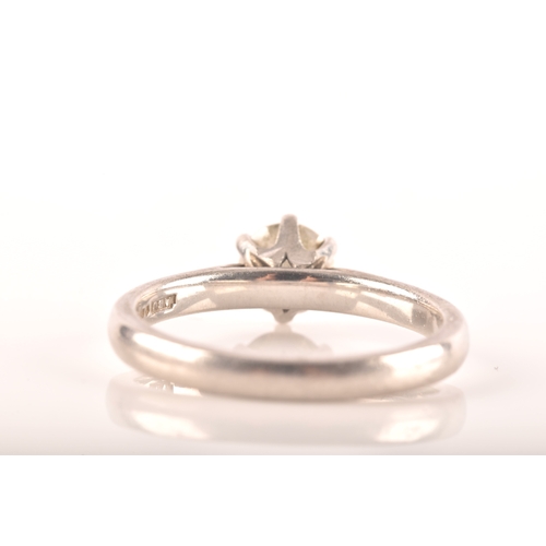 7 - A platinum solitaire ring, set to centre with a round brilliant cut diamond with a weight of 0.57 ca... 