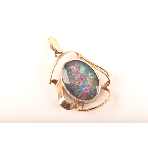 96 - A 9ct yellow gold pendant, set with a oval cabochon opal triplet measuring approximately 16 x 12mm.