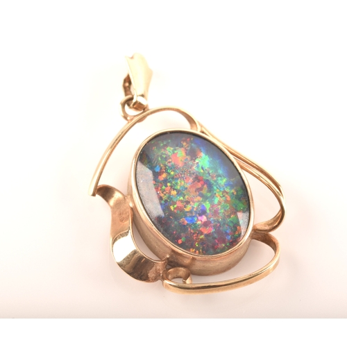 96 - A 9ct yellow gold pendant, set with a oval cabochon opal triplet measuring approximately 16 x 12mm.