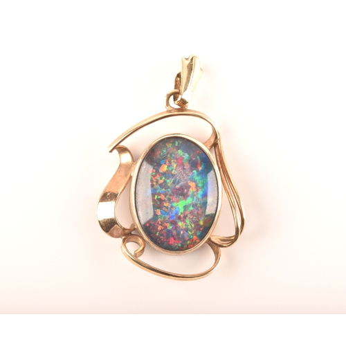 96 - A 9ct yellow gold pendant, set with a oval cabochon opal triplet measuring approximately 16 x 12mm.