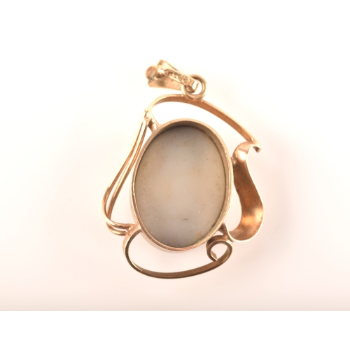 96 - A 9ct yellow gold pendant, set with a oval cabochon opal triplet measuring approximately 16 x 12mm.