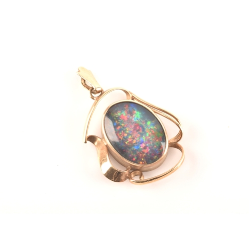 96 - A 9ct yellow gold pendant, set with a oval cabochon opal triplet measuring approximately 16 x 12mm.