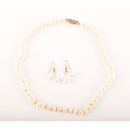 97 - A pair of 9ct yellow gold pearl drop earrings, together with a single strand of freshwater pearls st... 