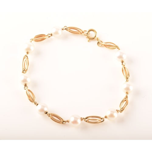 85 - An 18ct yellow gold Akoya cultured pearl bracelet, nine linked sections with eight 6mm pearls, 18cm ... 