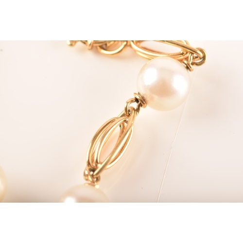 85 - An 18ct yellow gold Akoya cultured pearl bracelet, nine linked sections with eight 6mm pearls, 18cm ... 