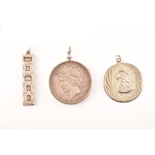 81 - A collection of silver jewellery, including a silver one dollar coin pendant, a sterling silver leaf... 