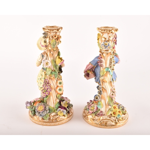 316 - A pair of 19th century porcelain figural candlesticks, possibly Derby, with Savoyard figures of male... 