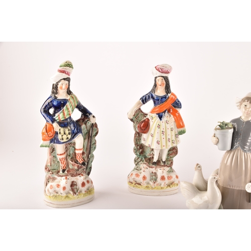 316 - A pair of 19th century porcelain figural candlesticks, possibly Derby, with Savoyard figures of male... 