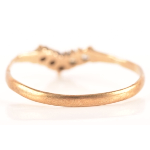 86 - Three 9ct yellow gold rings, including a 9ct gold and paste wishbone ring, a 9ct gold and diagonally... 