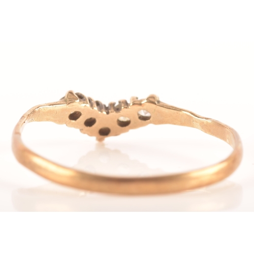 86 - Three 9ct yellow gold rings, including a 9ct gold and paste wishbone ring, a 9ct gold and diagonally... 