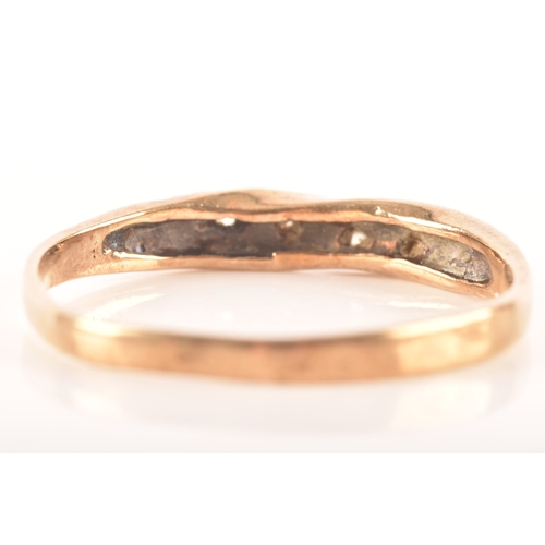 86 - Three 9ct yellow gold rings, including a 9ct gold and paste wishbone ring, a 9ct gold and diagonally... 