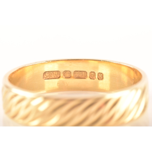 56 - An 18ct gold wedding band, hallmarked for London 1982 by Slade & Woolf Ltd, with wave design eng... 